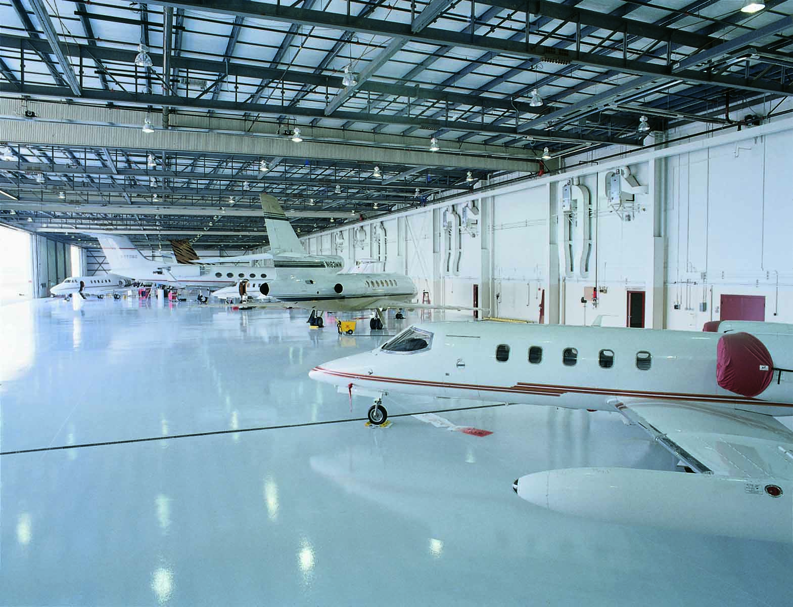 Inside HPN hangar, corporate jets.